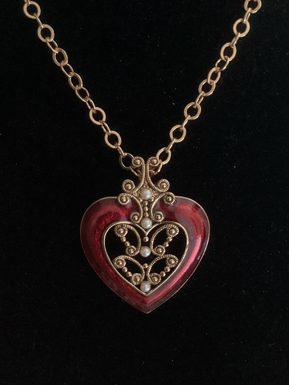 Gold-Tone Red Heart Pendant Necklace with Filigree and Pearl Accents by Avon.